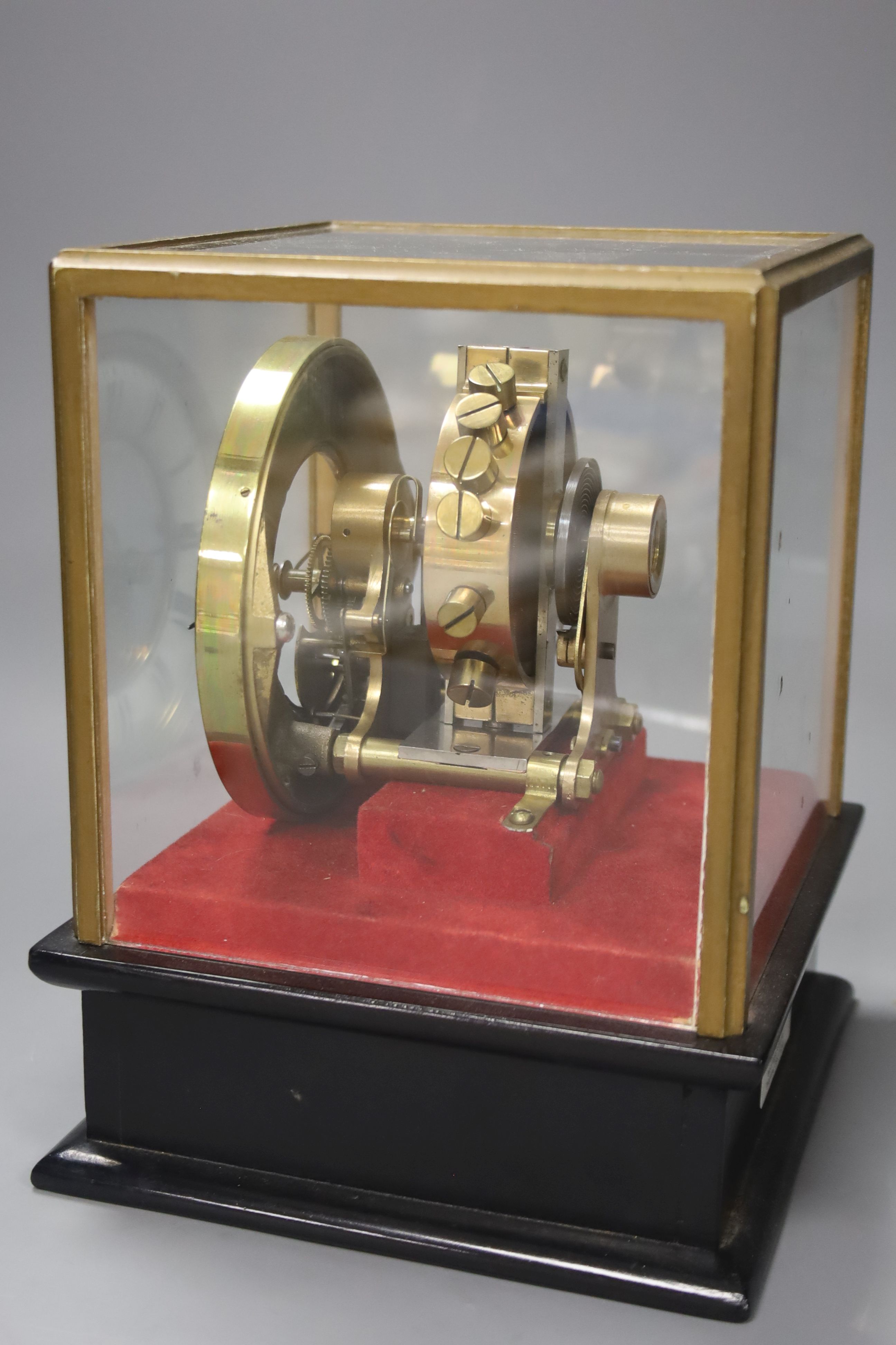 A Eureka Clock Co. Ltd electric clock in four glass case